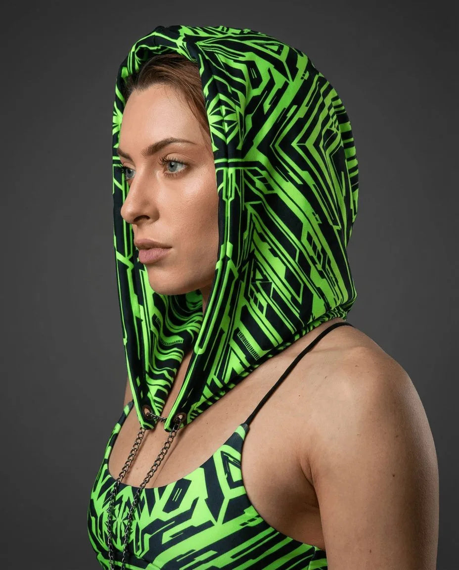 Techtronix Assassin Hood in electric lime green and black, worn by a woman from the side, perfect for a rave festival.