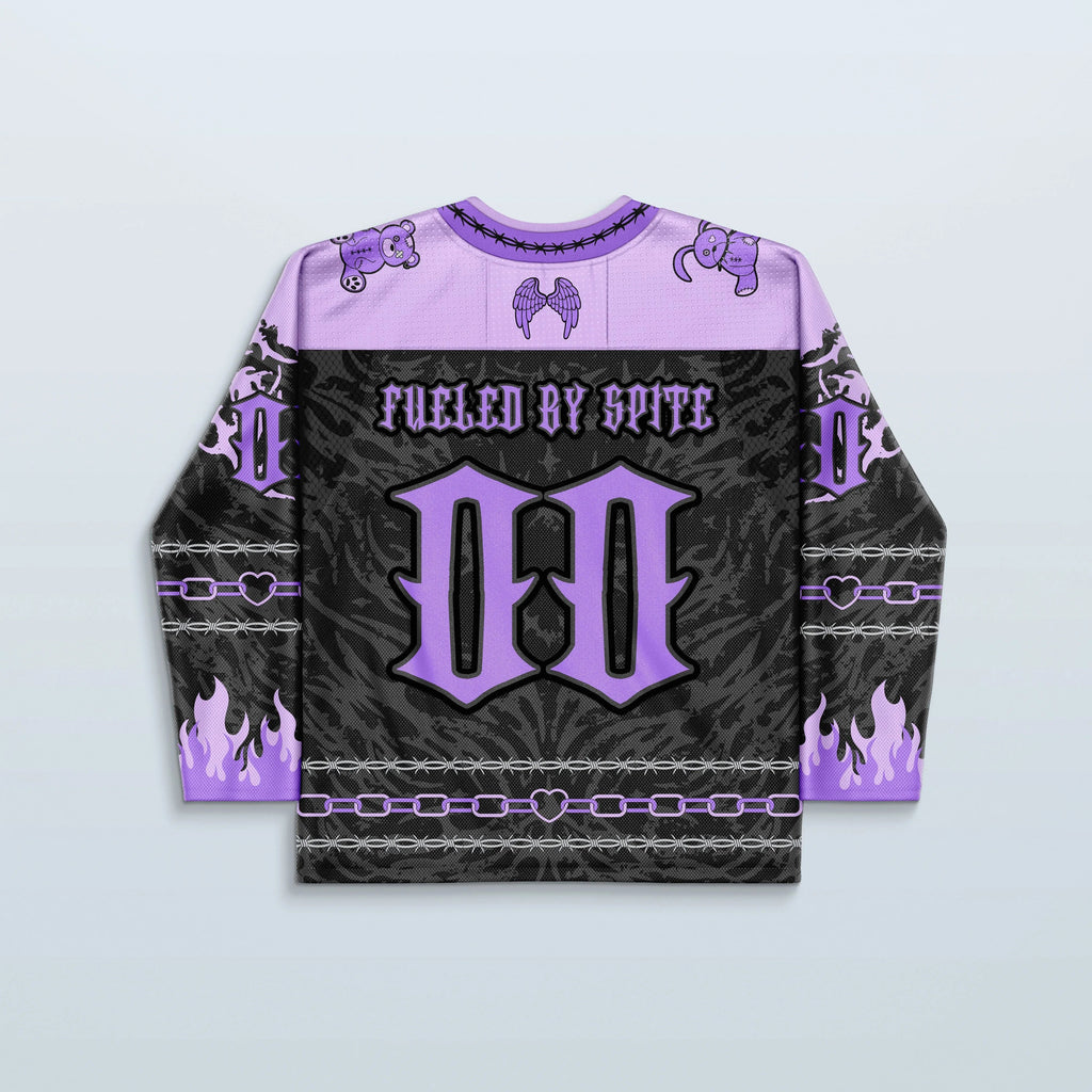 The back of the Cute But Psycho V2 Purple rave jersey, showcasing a black and purple design with "FUELED BY SPITE" text, a large 'M', and purple flame details on the sleeves, perfect for a festival.