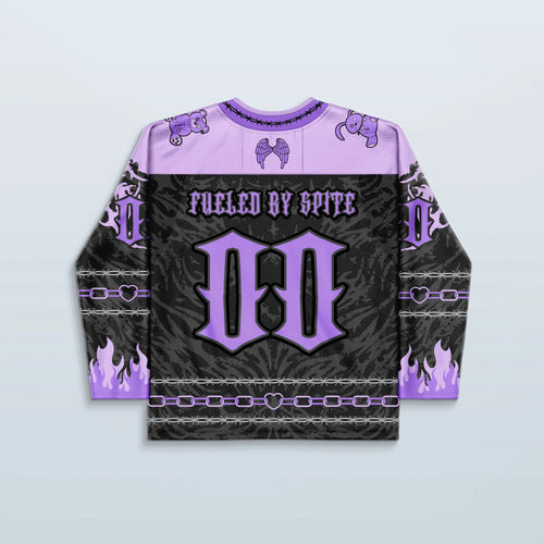 The back of the Cute But Psycho V2 Purple rave jersey, showcasing a black and purple design with "FUELED BY SPITE" text, a large 'M', and purple flame details on the sleeves, perfect for a festival.