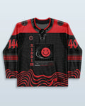 Riddim Hockey Jersey front view, black and red with a grid pattern and a red 'XX' smiley face, perfect for rave festivals.
