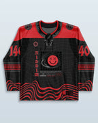 Riddim Hockey Jersey front view, black and red with a grid pattern and a red 'XX' smiley face, perfect for rave festivals.