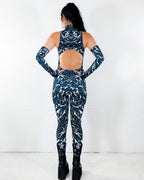 BLVDE Cold Shoulder Jumpsuit from the back, showing the black and white marble swirl print and open back cutout, perfect for a rave festival.