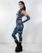 BLVDE Cold Shoulder Jumpsuit in black and white marble print, side view on a model, perfect for rave festivals