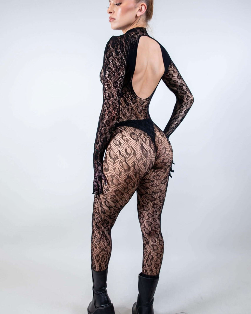 Cheetahlicious Full Body Fishnet Jumpsuit in black, seen from the back, perfect for a rave festival.