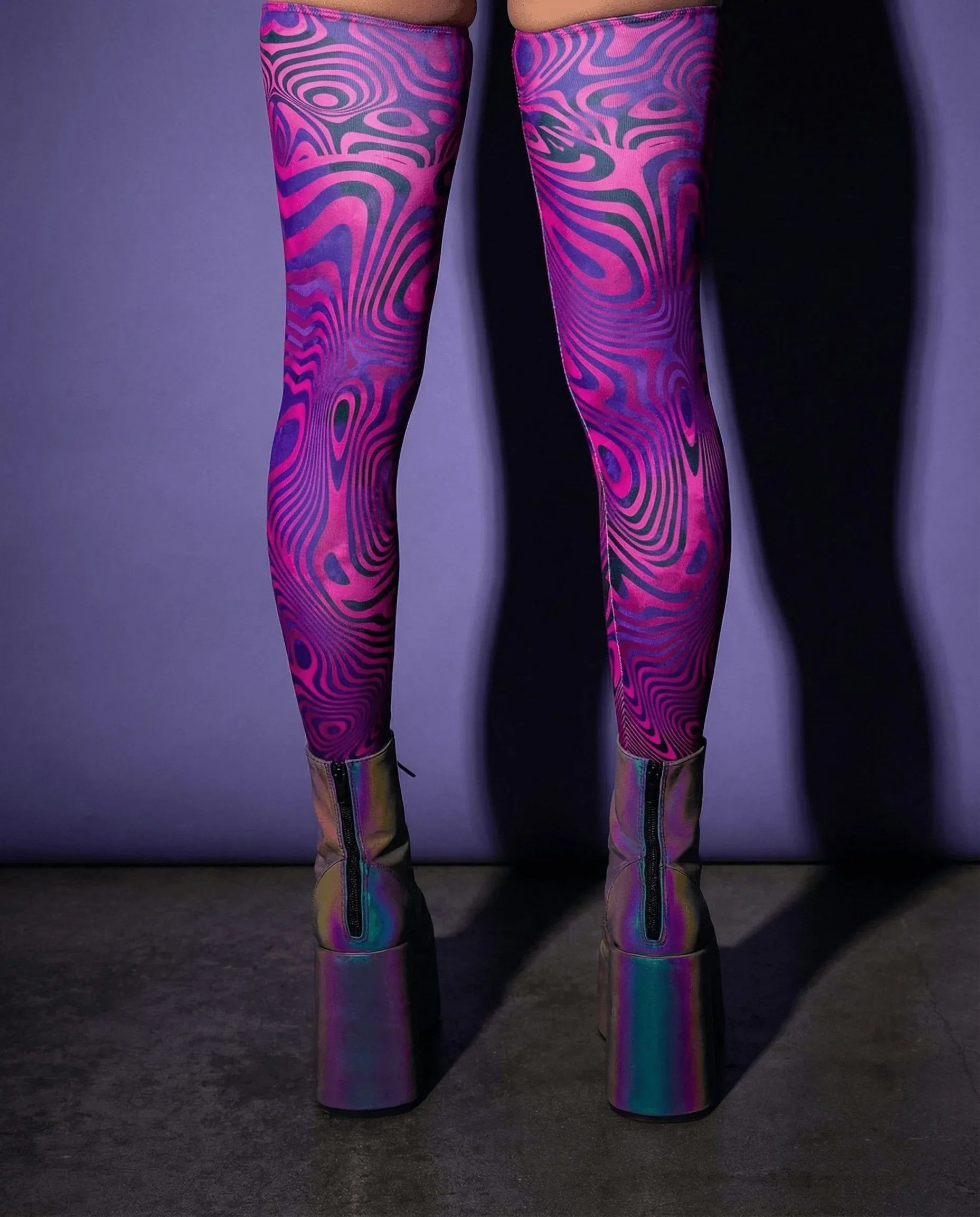Vanish Leg Sleeves from the back, featuring a psychedelic neon pink and purple swirl pattern, perfect for rave festivals.