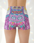 Back view of Moonlight high waisted rave pants with stained glass print and crescent moon motifs for festival outfits