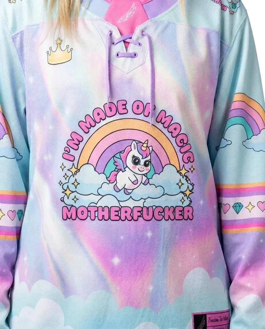 Front detail of a model wearing a pastel rainbow rave hockey jersey with 'I'M MADE OF MAGIC MOTHERFUCKER' unicorn graphic.