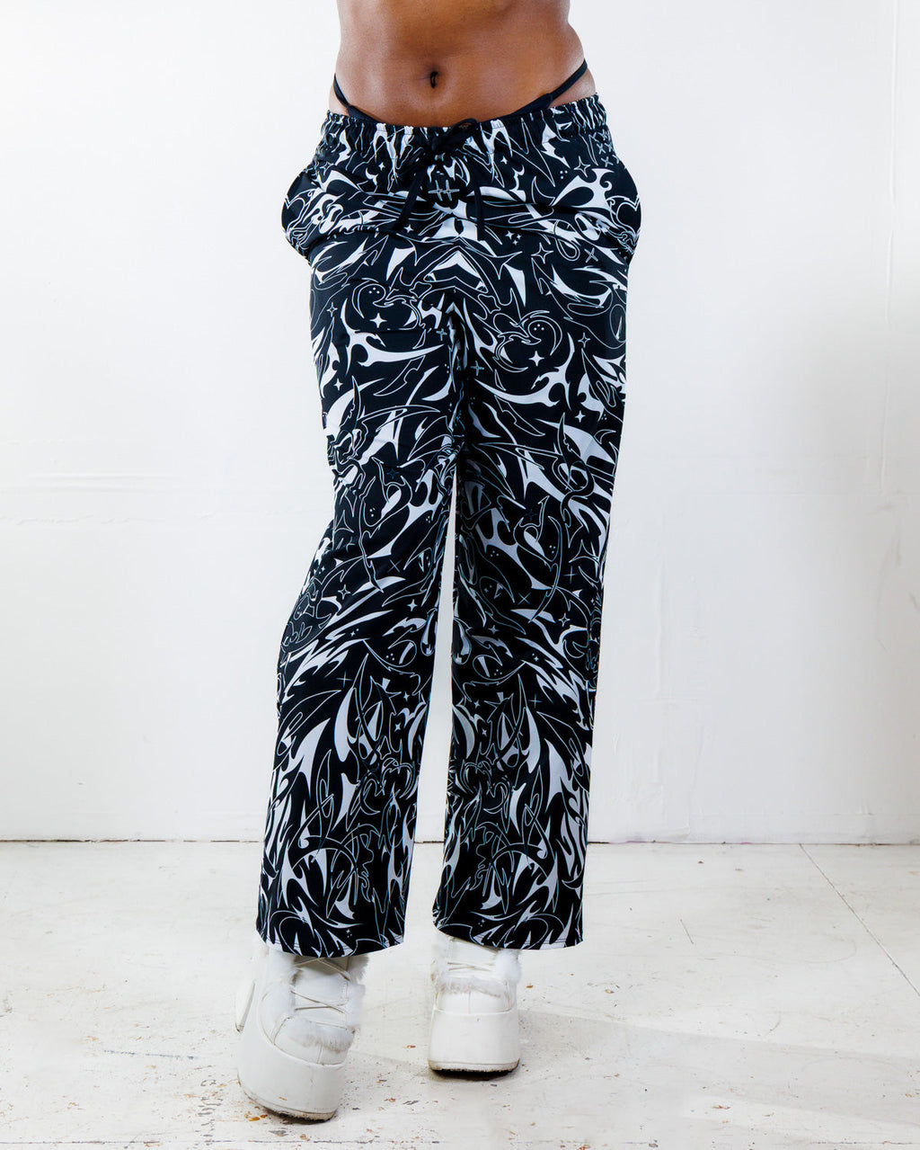 BLVDE Lucy Pants in black and white marble swirl print, front view, perfect rave festival bottoms.