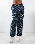 BLVDE Lucy Pants in black and white marble swirl print, front view, perfect rave festival bottoms.