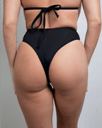 Matte Black High Waisted Thong rave pants back view showing cheeky coverage and high-waisted silhouette for festival outfits