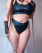 Midnight iridescent rave pants bottoms with holographic finish, festival outfit front view on model