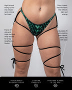 Green Predator scale print rave pants with black leg wrap ties front view festival outfit
