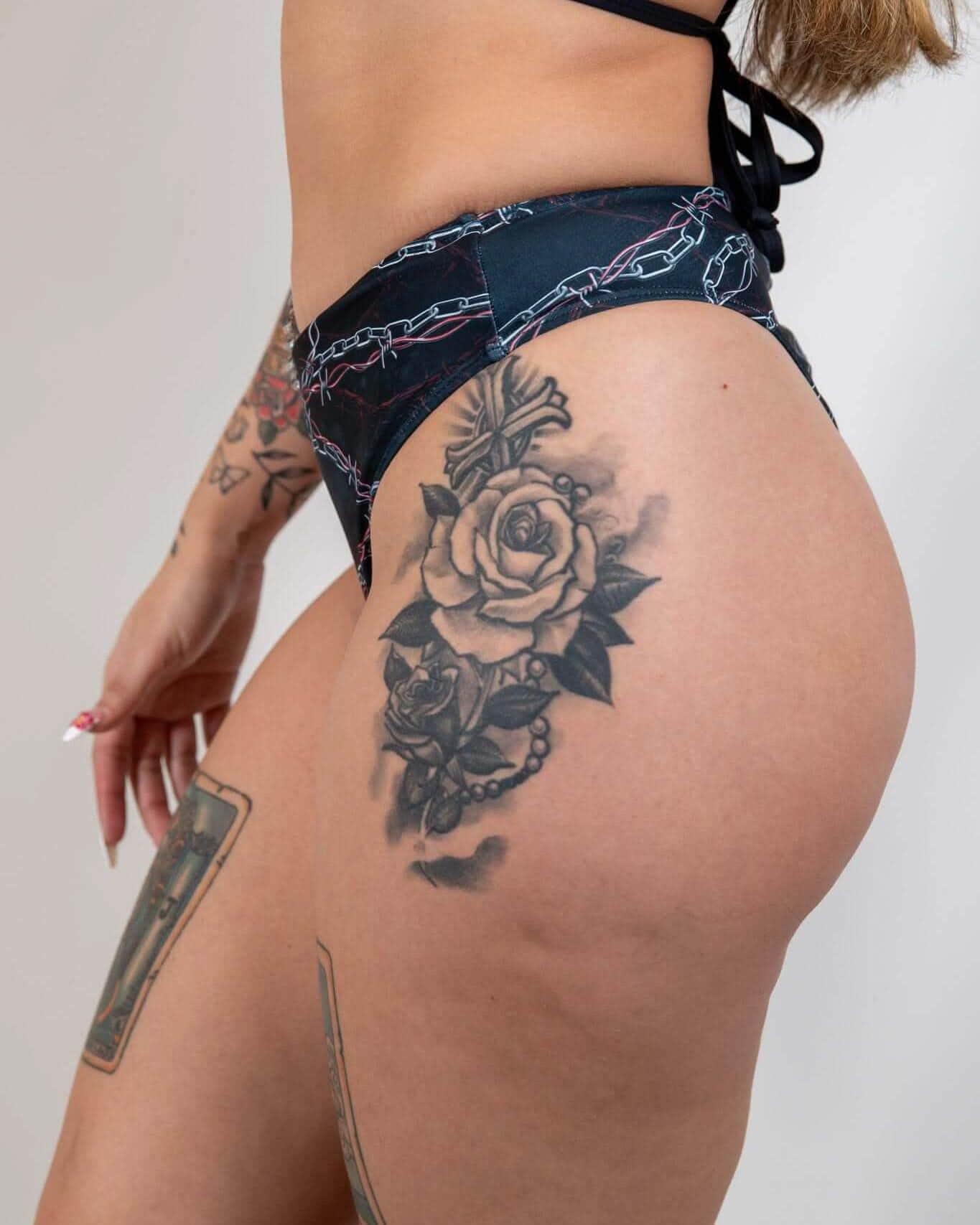 Purgatory high waisted rave pants with chain print shown in side view, festival outfit with dark edgy style