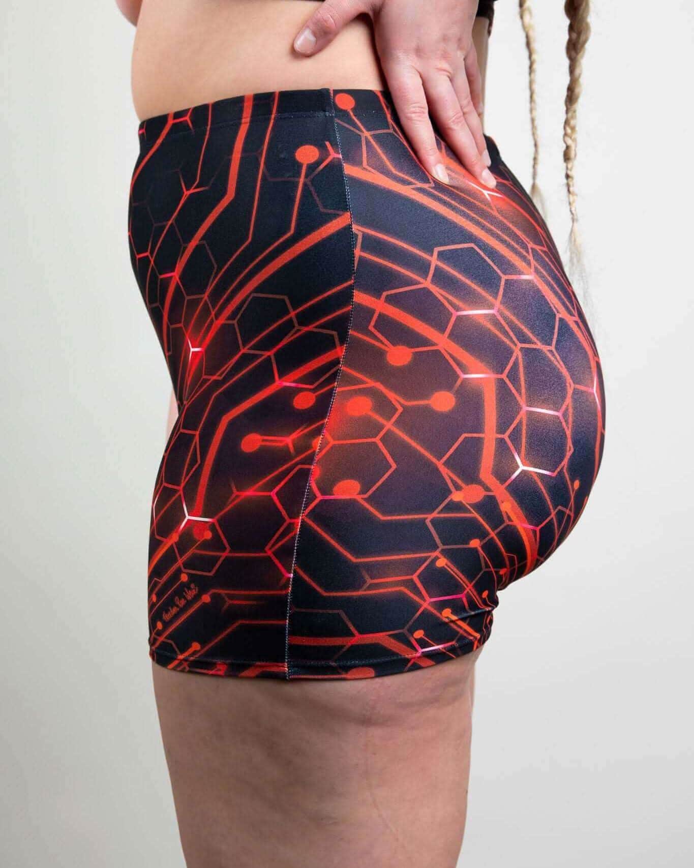 Red Singularity high waist rave pants with geometric circuit print - side view festival outfit styling