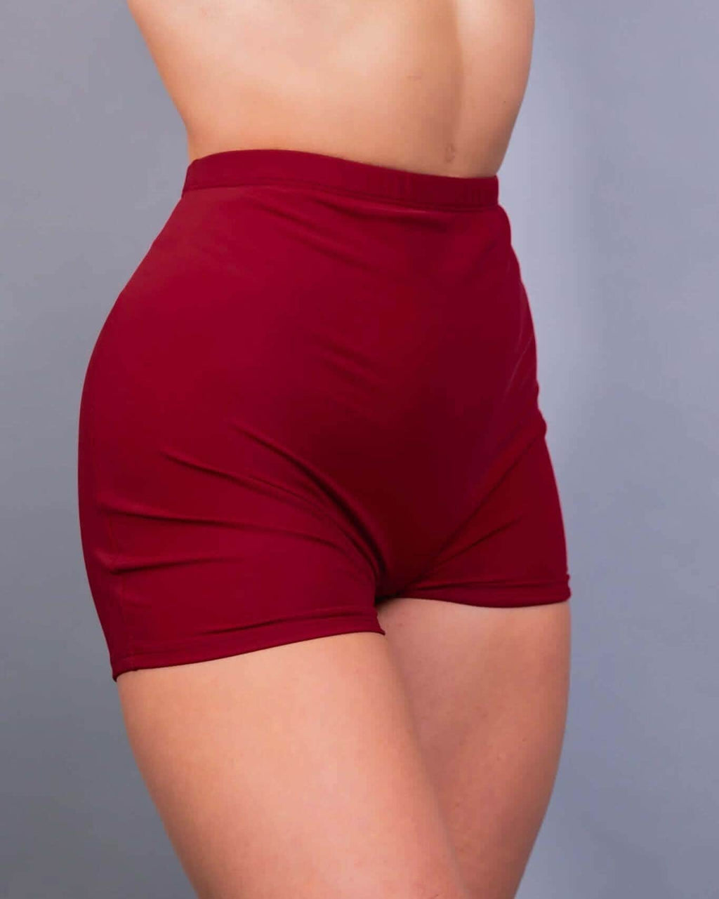 Scarlet red rave pants high waisted shorts side view showing ruched detailing festival wear