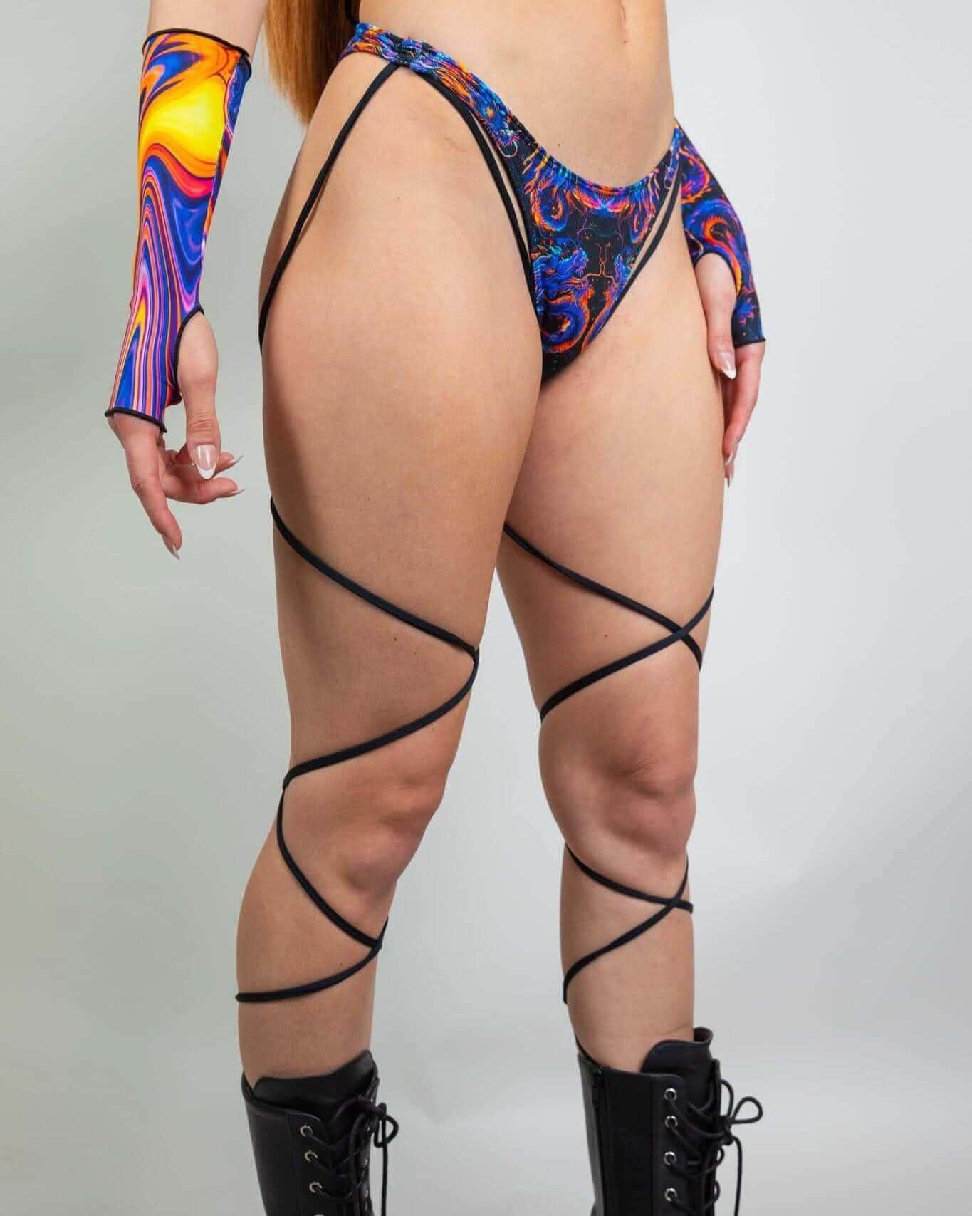 ShadowFlame rave pants back view showing blue orange dragon print strappy festival bottoms with matching arm sleeves