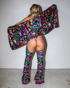 Awaken Festival Scarf shown from the back, displaying its vibrant psychedelic pattern with butterflies and mushrooms, perfect for rave fashion.