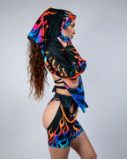 Blaze Festival Scarf worn by a model from the side, showcasing the neon flame pattern in orange, blue, and purple with teal galaxy speckles, perfect for rave or festival outfits.