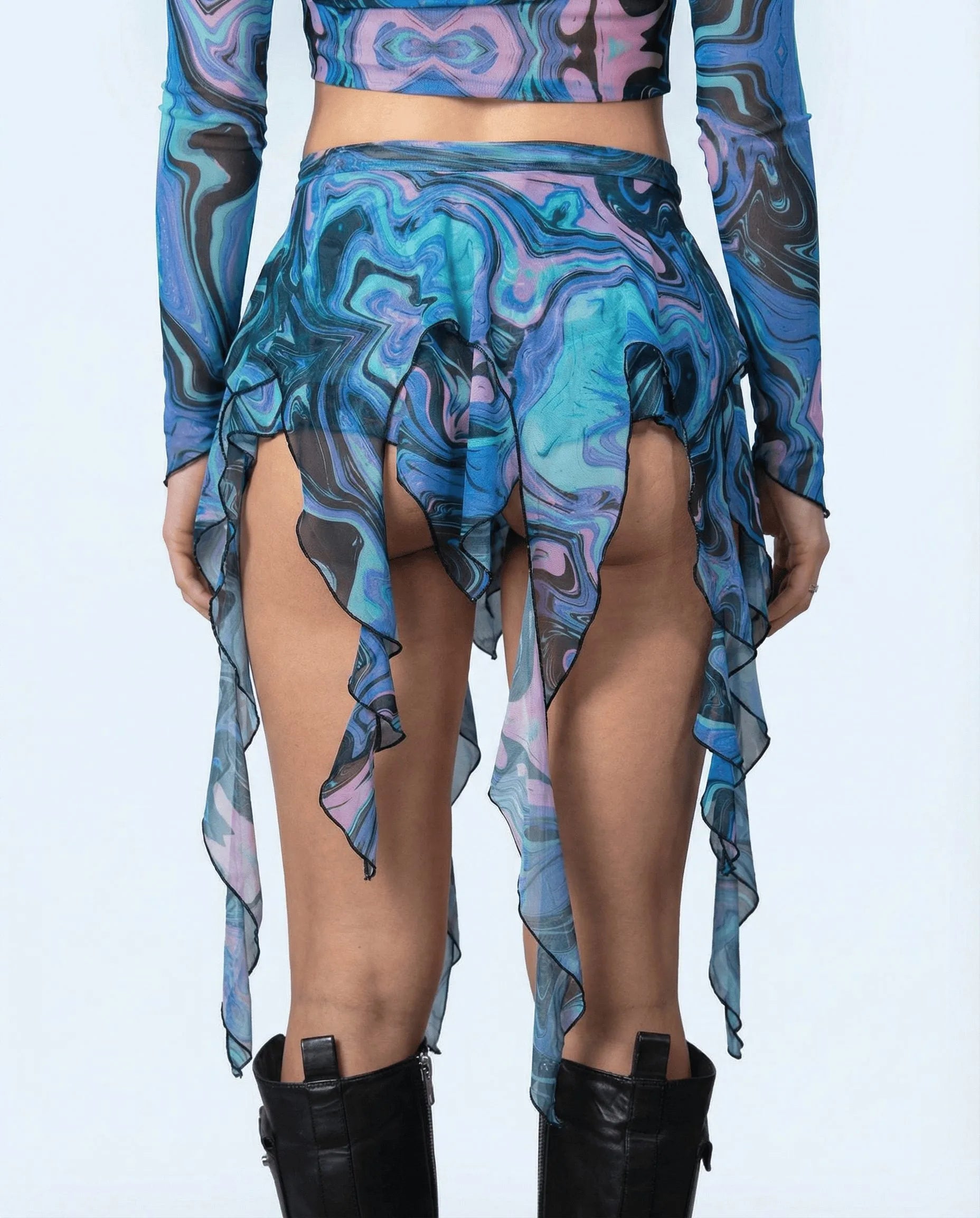 Glacial Sea Siren Skirt from the back, showing blue, teal, and pink liquid marble print with ruffled hem, perfect for rave festivals.