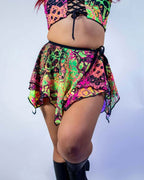 Back view of Intensity rave skirt with neon psychedelic print and flowing fairy layers for festival outfit