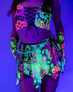 Intensity fairy rave skirt in neon psychedelic print glowing under blacklight with matching crop top festival outfit
