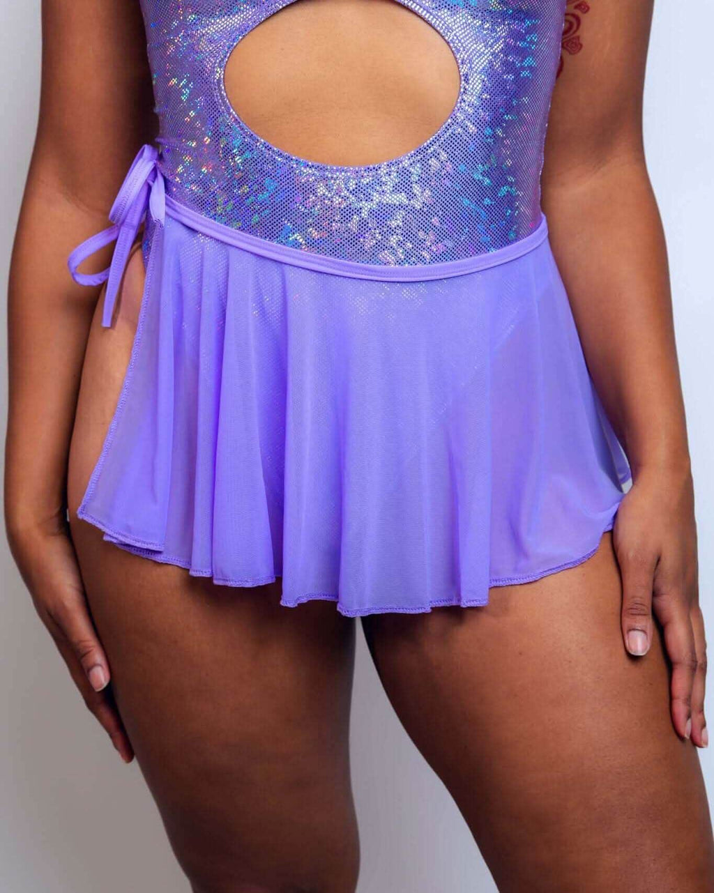 Lavender mesh swirl rave skirt with sequined top, model front view festival outfit styling