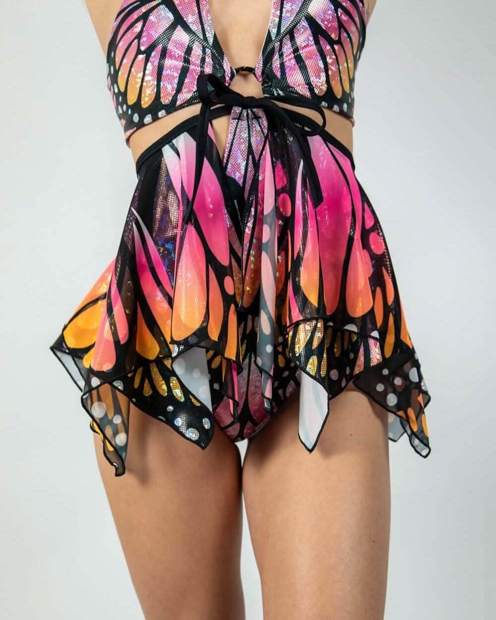 Monarch butterfly rave skirt with pink orange wings handkerchief hem festival outfit front view