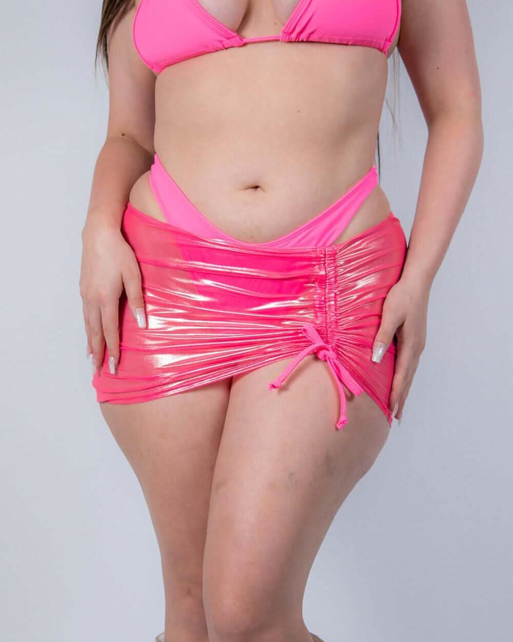 Pink holographic Peony mesh cinch rave skirt with drawstring detail worn by model front view
