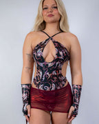 Red holographic Heartbreaker mesh cinch rave skirt on blonde model against white background