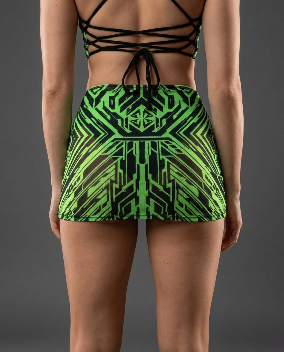Back view of Techtronix rave skirt in neon green geometric print with strappy festival top styling