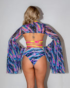 Acid Sky Mesh Bell Sleeves and matching bottoms from behind, showcasing the vibrant psychedelic pattern, perfect for rave festivals.