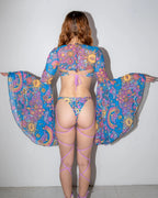 Groovy Mesh Bell Sleeves on a model's back, showcasing the dramatic flared sleeves and psychedelic rave pattern.