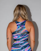 Acid Sky Slit Crop Top seen from the back, showcasing vibrant psychedelic colors and horizontal slits, perfect for a rave festival.