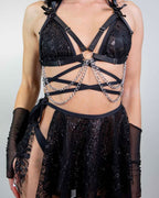 Black Lilith wrap rave top with silver chains and sparkly details modeled front view festival outfit