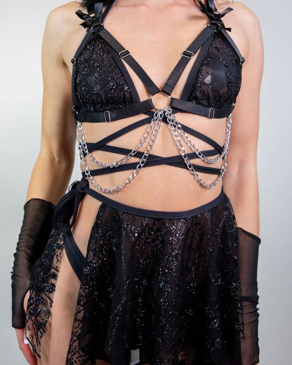 Black Lilith wrap rave top with silver chains and sparkly details modeled front view festival outfit
