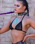 Black mesh rave top bikini style worn by festival model with blue glitter body art and chain collar
