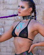 Black mesh rave top bikini style worn by festival model with blue glitter body art and chain collar