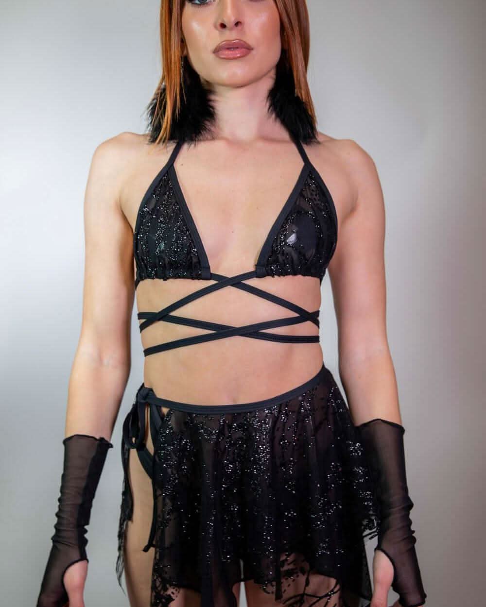 Black sequined Lilith wrap rave top with criss-cross straps modeled with matching festival outfit