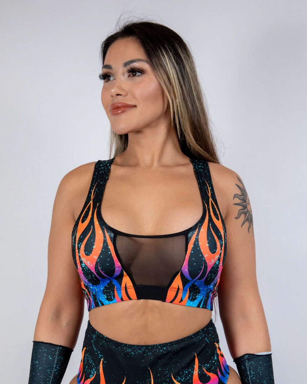 Blaze flame rave top with mesh V-panel in orange and blue flames on black backdrop
