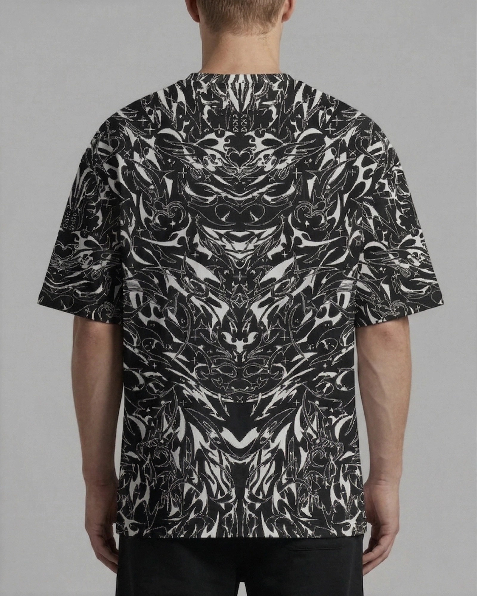 BLVDE Oversized Softee t-shirt from the back, featuring an intricate black and white rave pattern, perfect for festivals.