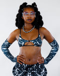 BLVDE Wonder Top in black and white, front view, worn by a model with matching arm sleeves and shorts, perfect for a festival rave.