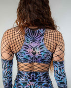 Back view of holographic Chromium rave top with fishnet sleeves and matching bottoms festival outfit