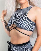 Distortion rave top with black white geometric pattern and crisscross straps festival outfit front view