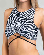 Rave top with black white distortion optical print and crisscross straps festival outfit front view