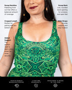 Dominion Scoop Neck Tank Top detail shot, green mandala print with dinosaur silhouettes, highlighting scoop neckline and wide straps for rave festivals.