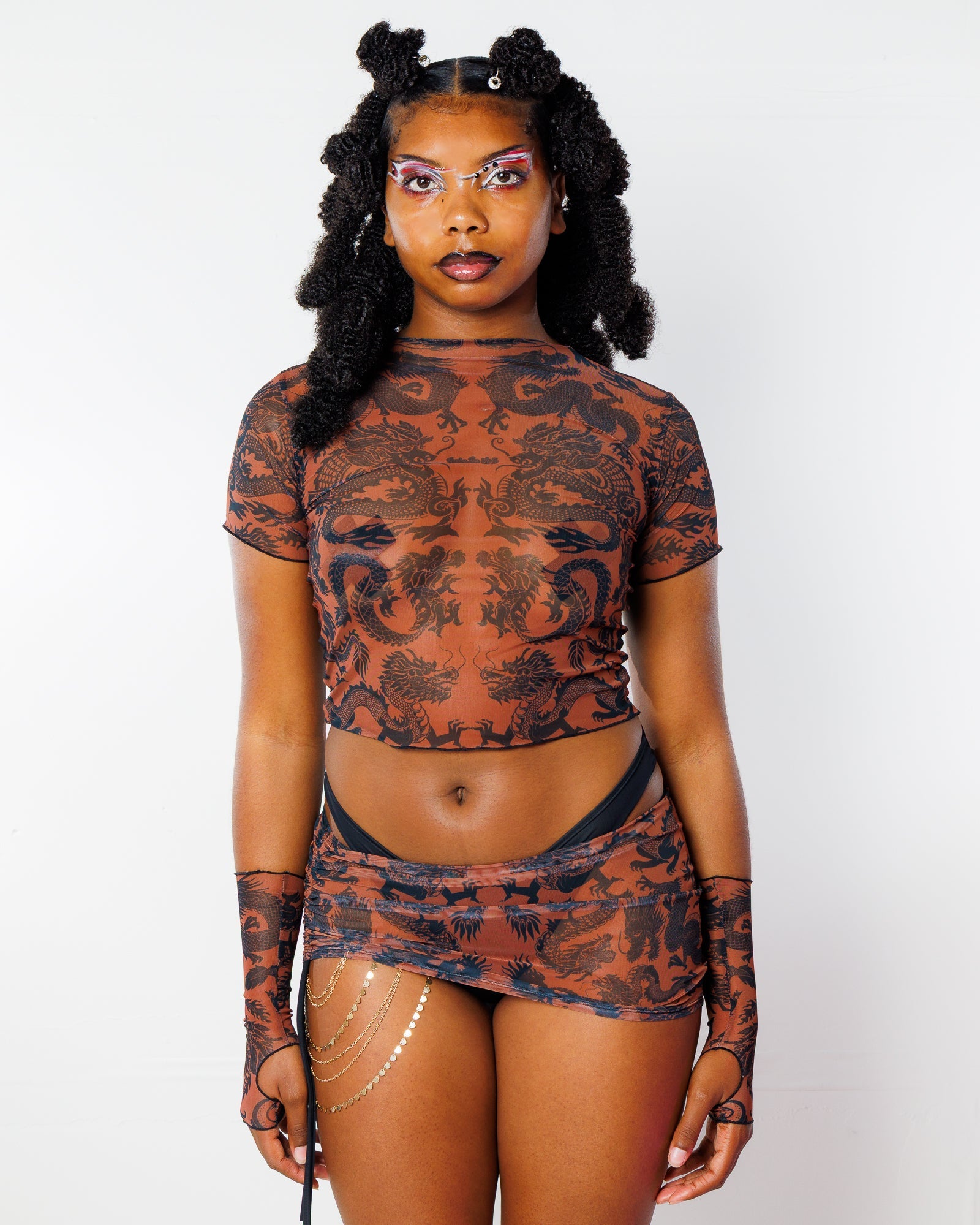 Dynasty Baby Tee in Caramel, front view. Sheer mesh rave top with black dragon print, matching skirt, and arm sleeves.