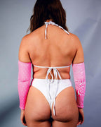 Back view of Electricity wrap rave top in white with pink UV reactive arm sleeves for festival outfit