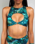 Faewood rave top with keyhole cutout in teal coral print, festival outfit front view