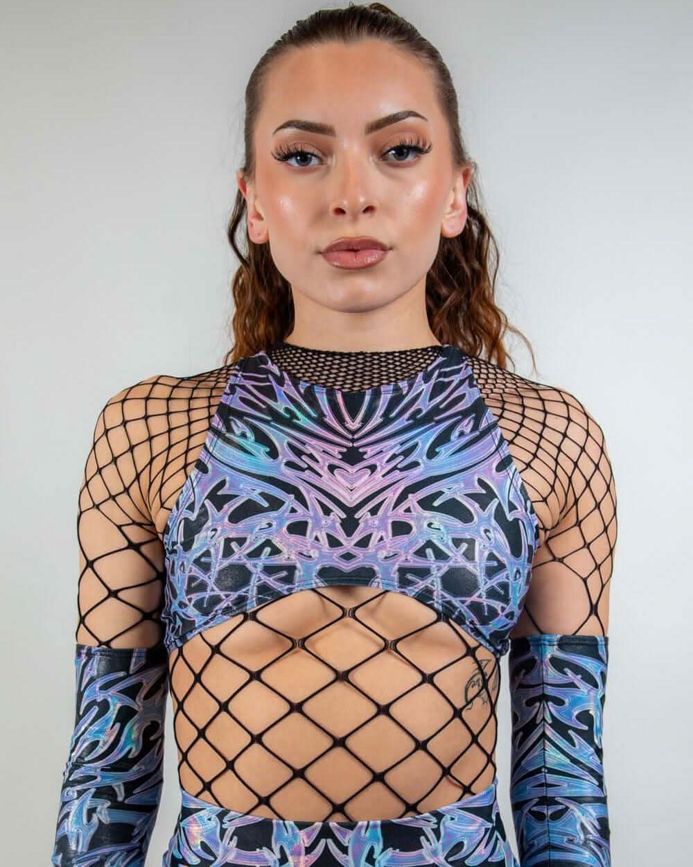 Holographic chromium rave top with black fishnet overlay modeled front view against white background