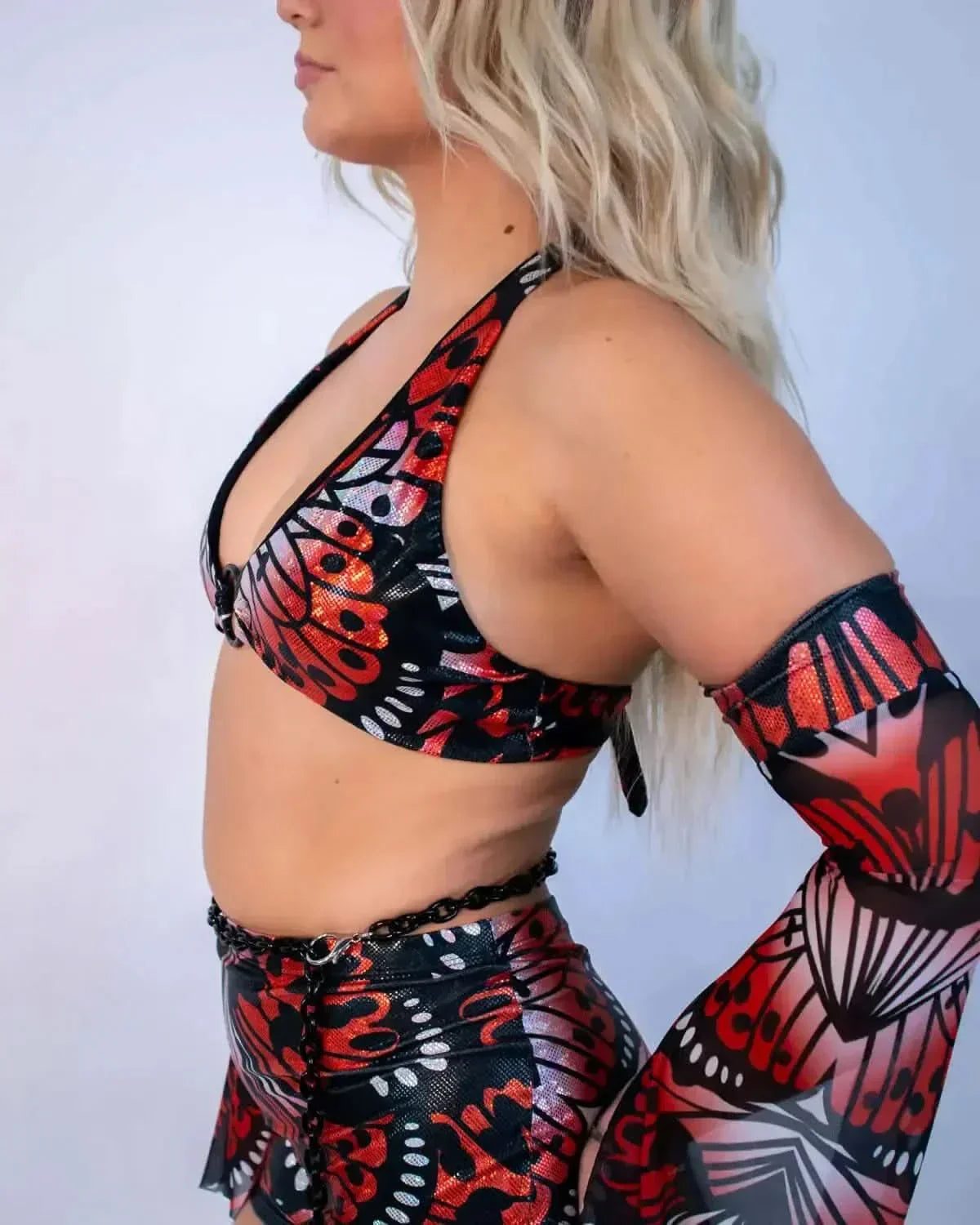 Lacewing O-Ring rave top side view showing butterfly wing pattern halter with matching festival outfit accessories